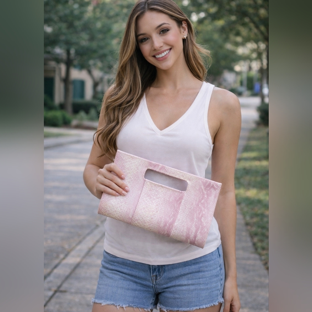 Charming Charlie pink snakeskin clutch